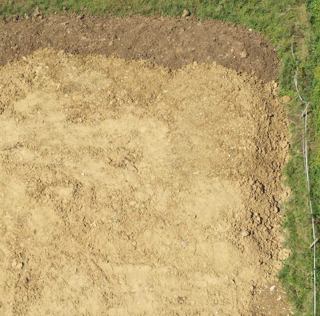 Measure construction site stockpile drone image